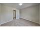 This bedroom features neutral carpet, fresh paint, and abundant light at 1206 Kern Cv, Mcdonough, GA 30253