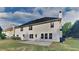 Home exterior featuring backyard patio and well-manicured lawn at 1206 Kern Cv, Mcdonough, GA 30253
