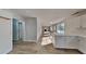 Open-concept space featuring kitchen with island and a sun-drenched living area with lots of natural light at 1206 Kern Cv, Mcdonough, GA 30253