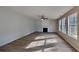 Bright living room with new flooring, many windows, and a cozy fireplace at 1206 Kern Cv, Mcdonough, GA 30253