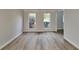 Inviting room showcasing new flooring, fresh paint, and bright windows at 1206 Kern Cv, Mcdonough, GA 30253