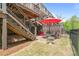Backyard featuring a patio under a raised deck, along with a privacy fence at 126 Abbington River Ln, Atlanta, GA 30339