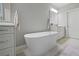 Bright and airy bathroom with a standalone soaking tub at 126 Abbington River Ln, Atlanta, GA 30339