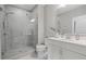 Modern bathroom featuring a glass-enclosed shower with stylish tile and a white vanity with a sleek countertop at 126 Abbington River Ln, Atlanta, GA 30339