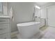 This bathroom features an oval tub, double vanity, and large mirror with recessed lighting at 126 Abbington River Ln, Atlanta, GA 30339