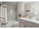 Stylish bathroom featuring a tub/shower combo with tiled walls, a vanity, and neutral decor at 126 Abbington River Ln, Atlanta, GA 30339