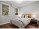 Comfortable bedroom featuring hardwood floors, neutral walls, and a serene atmosphere at 126 Abbington River Ln, Atlanta, GA 30339