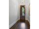 Inviting foyer with hardwood floors, a glass paneled front door, and neutral wall colors at 126 Abbington River Ln, Atlanta, GA 30339