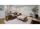 Comfortable living room boasts a leather couch, ottoman, and decorative rug at 126 Abbington River Ln, Atlanta, GA 30339