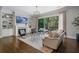 Elegant living room features built-in shelving, a fireplace, and sliding doors to an outdoor deck at 126 Abbington River Ln, Atlanta, GA 30339