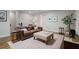 Inviting living room with a leather sofa, area rug, and stylish decor for a comfortable gathering space at 126 Abbington River Ln, Atlanta, GA 30339