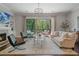 Open living room features fireplace, built-ins, and balcony access at 126 Abbington River Ln, Atlanta, GA 30339