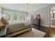 Serene main bedroom boasts large windows, hardwood floors, and a comfortable layout at 126 Abbington River Ln, Atlanta, GA 30339