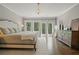 Beautiful main bedroom featuring natural light, wood floors, and a peaceful ambiance at 126 Abbington River Ln, Atlanta, GA 30339