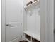 Well-organized mudroom with coat hooks, bench seating, and storage baskets for convenient everyday use at 126 Abbington River Ln, Atlanta, GA 30339