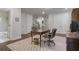 Home office adjacent to a bathroom featuring hardwood floors, neutral walls, and a decorative rug at 126 Abbington River Ln, Atlanta, GA 30339