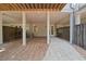Spacious covered patio area with brick walkway and access to the home's lower level at 126 Abbington River Ln, Atlanta, GA 30339