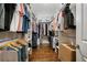 A large walk-in closet with hardwood floors and adjustable shelving provides plenty of storage space at 126 Abbington River Ln, Atlanta, GA 30339