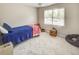 Cozy bedroom with soft carpet, comfortable single bed, and ample natural light at 2175 Eagle Trce, Cumming, GA 30040