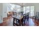 Elegant dining room with hardwood floors, large windows, staircase, and a table set for a meal at 2175 Eagle Trce, Cumming, GA 30040