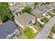 An aerial view of a well-maintained home showcasing its brick exterior and manicured landscaping in a suburban setting at 2311 Norbury Se Cv, Smyrna, GA 30080