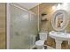 Bathroom with a glass shower door, pedestal sink, decorative mirror and a plant at 2311 Norbury Se Cv, Smyrna, GA 30080