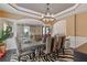 A formal dining room features modern chandelier, zebra rug and seating for six people at 2311 Norbury Se Cv, Smyrna, GA 30080