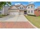 Attractive brick home with a spacious driveway, a two-car garage, and a neatly maintained front yard at 2311 Norbury Se Cv, Smyrna, GA 30080