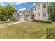 Beautiful two-story home with a brick facade, a three-car garage, and a professionally landscaped lawn at 2311 Norbury Se Cv, Smyrna, GA 30080