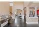 Inviting foyer with soaring ceilings, hardwood floors, arched doorways, and a glimpse into the living spaces at 2311 Norbury Se Cv, Smyrna, GA 30080