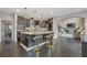 Kitchen with a marble island, black cabinets, stainless steel appliances, and barstool seating at 2311 Norbury Se Cv, Smyrna, GA 30080