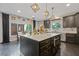 Stylish kitchen includes an island with marble countertop, dark cabinets, and modern lighting at 2311 Norbury Se Cv, Smyrna, GA 30080