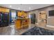 Spacious kitchen with wood floors, a breakfast bar, and an open floor plan to other living areas at 2311 Norbury Se Cv, Smyrna, GA 30080