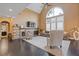 Living room with a fireplace, modern decor, vaulted ceiling, and lots of natural light at 2311 Norbury Se Cv, Smyrna, GA 30080