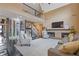 Spacious living room with vaulted ceiling, fireplace, modern decor, and an upstairs balcony at 2311 Norbury Se Cv, Smyrna, GA 30080