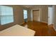 Bright bedroom with hardwood floors, featuring two windows and closet with sliding doors at 3082 Revere Ct, Atlanta, GA 30340