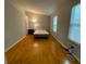 Spacious bedroom with hardwood flooring, natural light, and minimal furnishings at 3082 Revere Ct, Atlanta, GA 30340