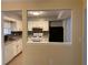 Open kitchen view with white appliances and cabinets at 3082 Revere Ct, Atlanta, GA 30340