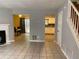 Open floor plan showing the living room with a fireplace and tile floors at 3082 Revere Ct, Atlanta, GA 30340