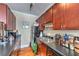 Functional kitchen features dark countertops, ample cabinet space, a black refrigerator and stainless steel sink and appliances at 733 Frederica Ne St # 2, Atlanta, GA 30306