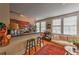 Open-concept kitchen and living room featuring hardwood floors, bright windows, and a comfortable seating area with stylish rug at 733 Frederica Ne St # 2, Atlanta, GA 30306