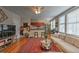 Cozy living room with hardwood floors, modern furniture, a decorative rug, and an open flow to the adjacent kitchen at 733 Frederica Ne St # 2, Atlanta, GA 30306