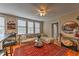 Open-concept living area with windows, modern furniture, a stylish rug, and an open flow to the adjacent kitchen at 733 Frederica Ne St # 2, Atlanta, GA 30306