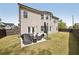 View of the home's backyard with a patio and outdoor seating area at 2100 Baywood Sw Blvd, Austell, GA 30106