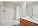 Bathroom featuring a combination tub and shower, a modern vanity, and neutral-colored walls at 2100 Baywood Sw Blvd, Austell, GA 30106