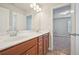 Bright bathroom featuring double sinks, cherry cabinets, modern fixtures, and a tile floor at 2100 Baywood Sw Blvd, Austell, GA 30106
