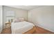 Cozy bedroom with a neutral color palette, comfortable bed, and a side table at 2100 Baywood Sw Blvd, Austell, GA 30106