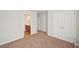 This bedroom offers plush carpeting, ample storage with a double closet, and access to the en suite at 2100 Baywood Sw Blvd, Austell, GA 30106