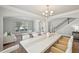 Elegant dining room with an oversized table, open to living room, and a neutral color palette at 2100 Baywood Sw Blvd, Austell, GA 30106