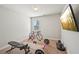 Home exercise room with TV, free weights, and exercise equipment at 2100 Baywood Sw Blvd, Austell, GA 30106